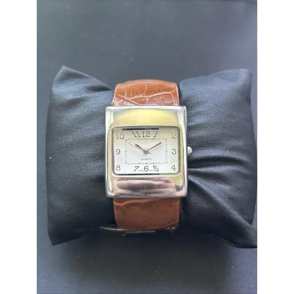 Silver Case White Dial Brown Band Women’s Cuff Watch
